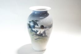 A large Royal Copenhagen vase, depicting a boy fishing on the bank of a lake,