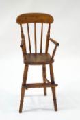 A late Victorian child's high chair, with elm seat, missing front rail,