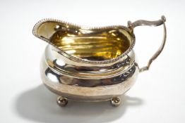 A George III silver cream jug, London 1814, maker possibly Samuel Hougham,