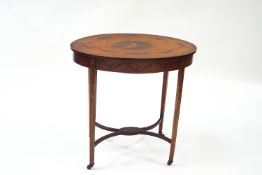 An Edwardian satinwood oval occasional table, with under tier,