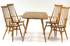 An Ercol elm dining table, 153cm wide x 77cm deep x 71cm high,