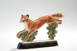 A Rye Pottery model of a jumping fox, printed factory marks,