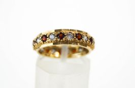 A 9 carat gold garnet and cubic zirconia full eternity ring, finger size L, 2.