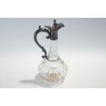 A Victorian cut glass claret jug with plated mounts,