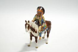 A Beswick model of a mounted Indian, black printed mark,