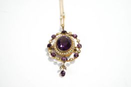 An Amethyst and seed Pearl pendant brooch,the large oval cut enclosed by seed pearls,