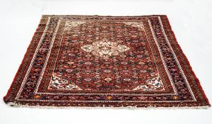A 20th century Persian carpet with geometric decoration,