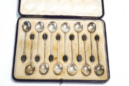 A set of twelve Asprey & Co Ltd Silver coffee bean spoons, 90g gross,