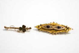 A 9 carat gold garnet and rose diamond brooch,