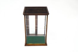 A late 19th/early 20th Century shop display cabinet, with sliding doors and replacement shelves,