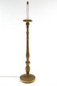 A decorative giltwood standard lamp, carved in the Classical style with palmettes to the base,
