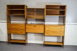 A three section ladderax wall unit, comprising two boxes with drawers, two open bookcase shelves,