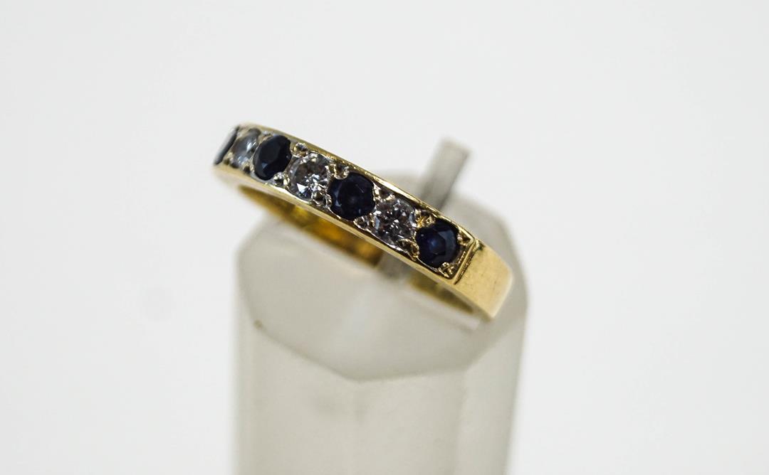 An 18 carat gold seven stone sapphire and diamond half hoop ring, - Image 2 of 2