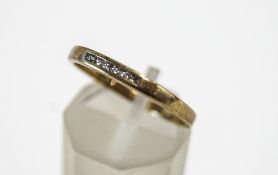 A 9 carat gold seven stone diamond ring, the single cuts channel set, finger size P1/2, 1.