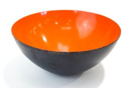 A Danish 'Krenit' enamel bowl with orange interior, by Herbert Krenchel,
