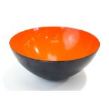 A Danish 'Krenit' enamel bowl with orange interior, by Herbert Krenchel,