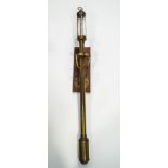 An early 20th Century brass marine barometer, the gauge inscribed 16a22, R.N.