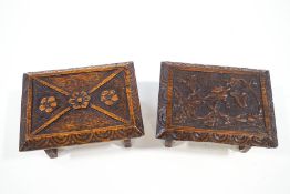 Two unusual oak stools, heavily carved with ivy and flowerheads, one dated July 1899, 28.
