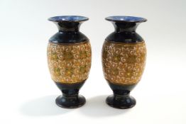 A pair of Royal Doulton stoneware vases, impressed marks to base,