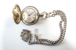 Elgin, a large metal hunter pocket watch, 6 cm diameter,