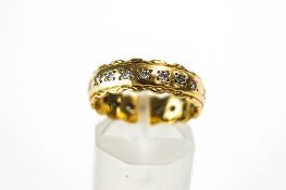 An 18 carat gold twenty stone diamond eternity ring, the brilliant cuts totalling approximately 0.