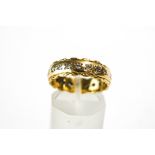 An 18 carat gold twenty stone diamond eternity ring, the brilliant cuts totalling approximately 0.