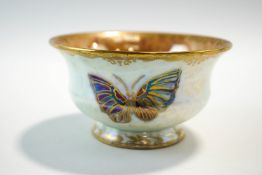 A Wedgwood lustre bowl, decorated with butterflies and ornate gilding, factory marks to the base,
