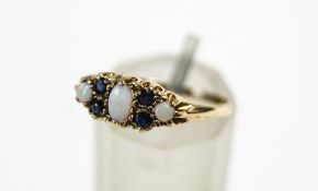 A 9 carat gold opal and sapphire dress ring, finger size O, 1.