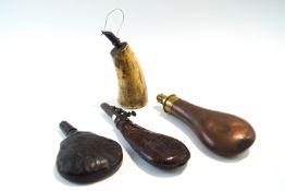 Four various 18th/19th Century powder and shot flasks, two leather, one copper and brass,