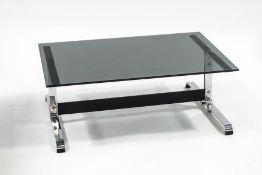 A 1970's Italian smoked glass top coffee table with chrome base,
