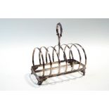 A Victorian silver toast rack, makers mark rubbed, London 1873, six division,
