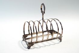A Victorian silver toast rack, makers mark rubbed, London 1873, six division,