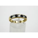 An 18 carat gold seven stone sapphire and diamond half hoop ring,