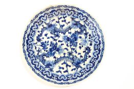 A 20th Century Chinese blue and white dish, decorated with two dragons,