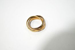 A three coloured 'Trinity' or Russian style wedding ring, stamped 750, weight 5.