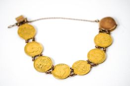 A bracelet of eight half Sovereigns, all soldered, including a shield back,