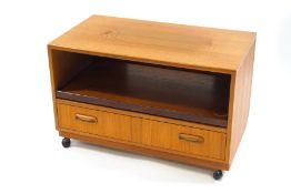A G-Plan Fresco teak television stand, with pull out shelf and drawer,