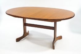 A G-Plan Fresco teak extending oval dining table, with fold out extending leaf, 72cm high x 160.