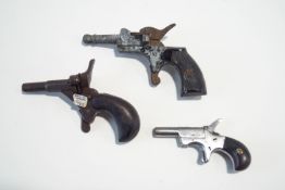 Three old starting pistols