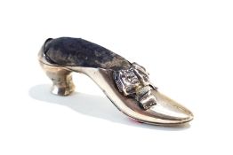 A silver pin cushion in the form of a shoe, marks rubbed and indistinct, circa 1900,