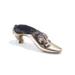 A silver pin cushion in the form of a shoe, marks rubbed and indistinct, circa 1900,