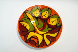 A Poole Pottery 'Delphis' shape 54 charger, designed by Cynthia Bennett,