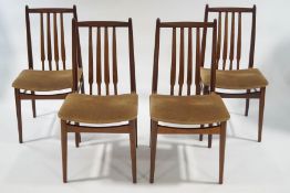 A G-Plan Fresco teak drop leaf dining table and four upholstered dining chairs,
