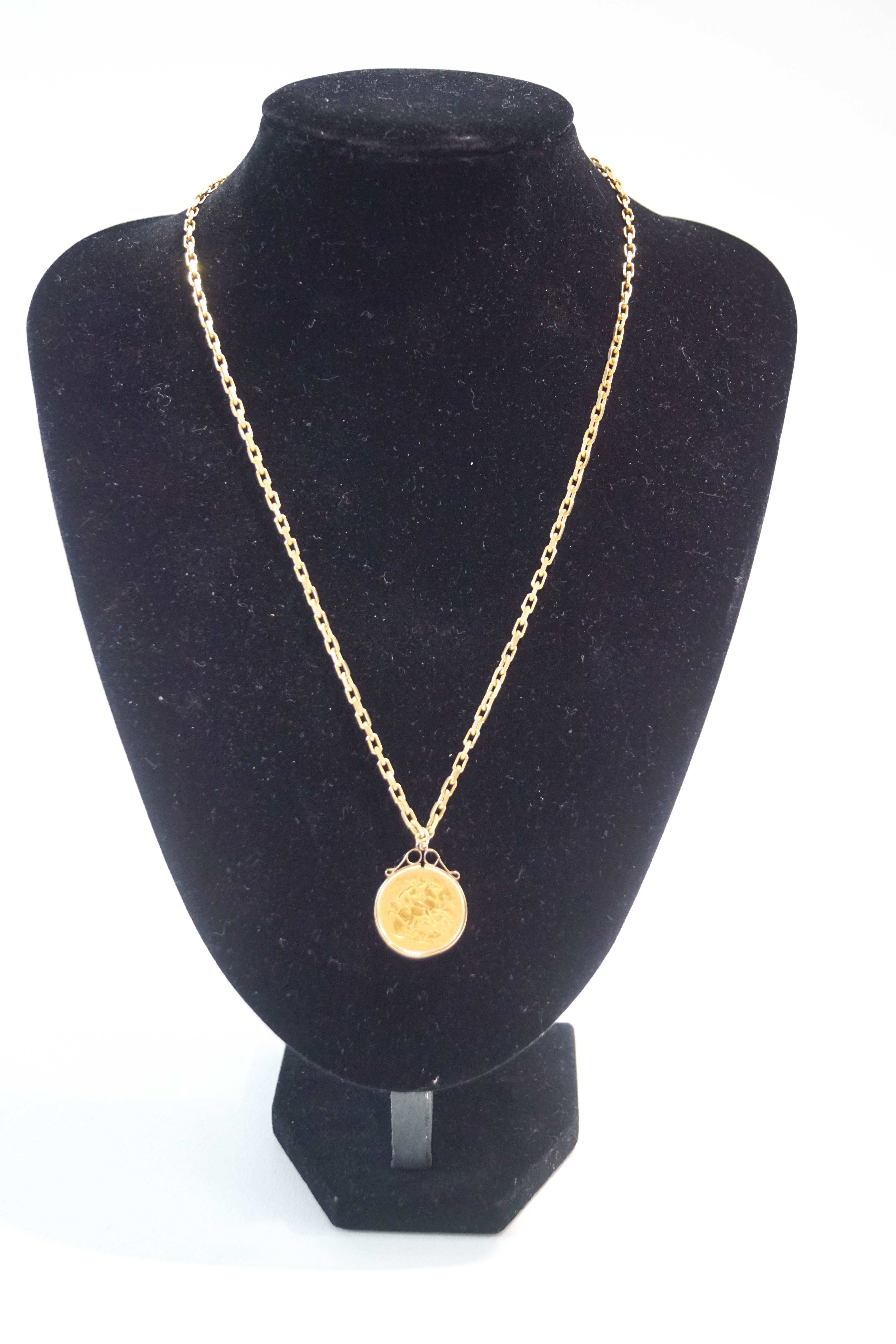 A 1925 Sovereign, in a plain pendant mount, on a 9 carat gold chain, 46 cm long, 19.