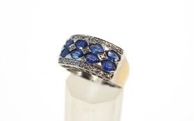 A 14 carat white gold sapphire and diamond dress ring,