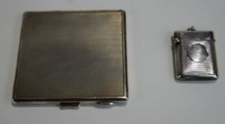 A late Victorian silver vesta case, Birmingham 1899; and a silver cigarette case; 116 g (3.