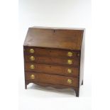 A 19th Century mahogany bureau with pigeon hole and drawer interior,