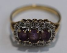 A 9 carat gold amethyst and illusion set single cut diamond cluster ring, finger size P, 2.