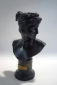 A black alabaster bust of Atlanta, on a marble socle base, signed F.J.