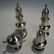 A pair of late Victorian silver pepperettes, Sheffied 1895; a small silver mustard pot and pepper,